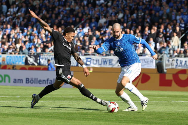 2026.10.10 Fussball 2.Bundesliga SV Darmstadt 98 - Energie Cottbus v.l., Justin Butler (Energie Cottbus), Aleksander Vukovic (SV Darmstadt 98), battles for the Ball Copyright: HMBxMedia JoaquimxFerreira