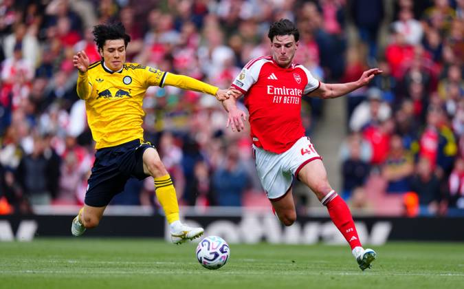 Ao Tanaka of Leeds United tackles Declan Rice of Arsenal Arsenal v Leeds United, Premier League, Football, Emirates Stadium, London, UK - 10 Oct 2026London Emirates Stadium United Kingdom EDITORIAL USE ONLY No use with unauthorised audio, video, data, fixture lists, club league logos or live services. Online in-match use limited to 120 images, no video emulation. No use in betting, games or single club league player publications. Copyright: xJavierxGarcia Shutterstockx 17204400v