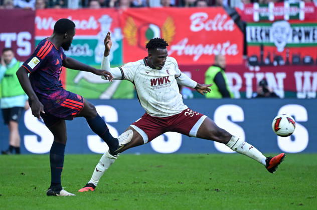 10.10.2026, xemx, Fussball 1.Bundesliga, FC Augsburg - Bayern München v.l. Dayot Upamecano (FC Bayern Muenchen), Juma Bah (FC Augsburg) Zweikampf, Aktion, action, battle for the ball (DFL DFB REGULATIONS PROHIBIT ANY USE OF PHOTOGRAPHS as IMAGE SEQUENCES and or QUASI-VIDEO) Augsburg