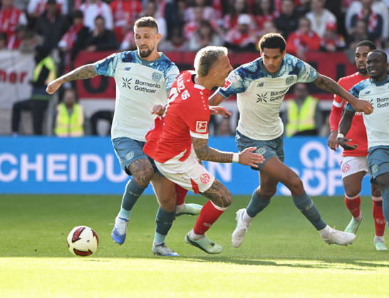 Fussball-Bundesliga - Saison 2026 2027 Mewa-Arena Mainz - 10.10.2026 1. FSV Mainz 05 (mz) - Bayer Leverkusen (lev) V.li: Robert Andrich (Bayer Leverkusen), Phillip TIETZ (1. FSV Mainz 05), Jarell QUANSAH(Bayer Leverkusen) DFL REGULATIONS PROHIBIT ANY USE OF PHOTOGRAPHS AS IMAGE SEQUENCES AND OR QUASI VIDEO EDITORIAL USE ONLY NATIONAL AND INTERNATIONAL NEWS AGENCIES OUT Fussball-Bundesliga - 1. FSV Mainz 05