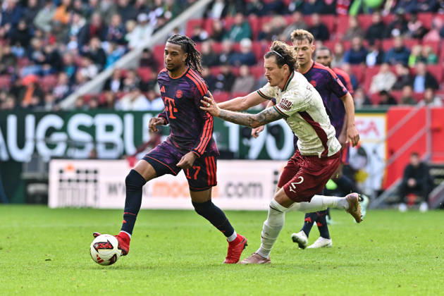 AUGSBURG, GERMANY; 10. OCTOBER: tackle between Michael OLISE (FC Bayern Munich 17) and Calvin BRACKELMANN (FC Augsburg 2) during the Bundesliga Match between FC Augsburg vs. FC Bayern Munich at Matchday 5 at WWK-Arena DFL REGULATIONS PROHIBIT ANY USE OF PHOTOGRAPHS AS IMAGE SEQUENCES AND OR QUASI-VIDEO Copyright: xBEAUTIFULxSPORTS Goldbergx