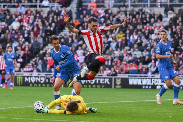 Enzo Le Fee of Sunderland jumps over Bart Verbruggen goalkeeper for Brighton & Hove Albion Sunderland v Brighton & Hove Albion, Premier League, Football, Stadium of Light, Sunderland, UK - 10 Oct 2026Sunderland Stadium of Light United Kingdom EDITORIAL USE ONLY No use with unauthorised audio, video, data, fixture lists, club league logos or live services. Online in-match use limited to 120 images, no video emulation. No use in betting, games or single club league player publications. Copyright: xRichardxLee Shutterstockx 17205894af