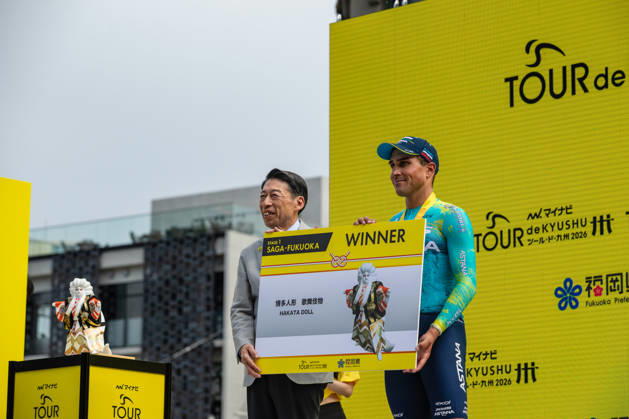 Tour De Kyushu Stage Finishes In Fukuoka s Tenjin For The First Time Matteo Malucelli of XDS Astana Team wins Stage 1 of the Mynavi Tour de Kyushu 2026 at the finish line on Tenjin Bridge in Fukuoka, Japan, on October 10, 2026. The Italian won the 152.0-kilometer Saga-Fukuoka stage in 3 hours 9 minutes 51 seconds, ahead of Luke Mudgway (Li Ning Star) and Alessio Delle Vedove (XDS Astana Team), and took the general and points classification leads. It was the first time the race finished in Tenjin, the commercial heart of Fukuoka, where a parade, stage events and food stalls marked the day. The race, first held in 2023 and part of the UCI Asia Tour (2.1 category), runs October 9-12 through six Kyushu prefectures under the official title We stand with Kumamoto. Mynavi Tour de Kyushu 2026, adopted to support areas affected by the Kumamoto earthquake. Fukuoka Japan Copyright: xRyoxChix originalFilename:zhi-tourdeky261010_np9X6.jpg