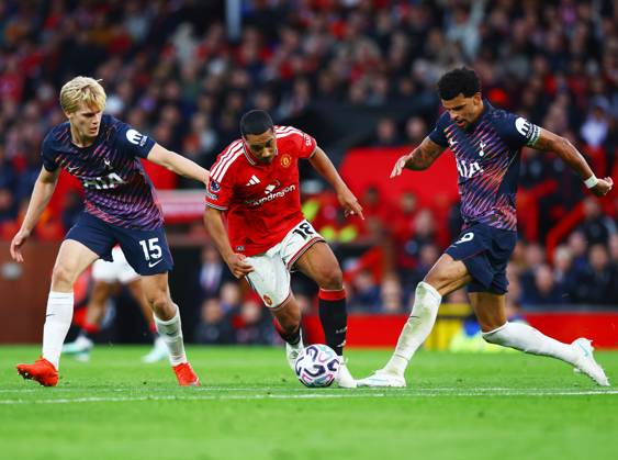 Youri Tielemans of Manchester United, ManU in between Lucas Bergvall and Dominic Solanke of Tottenham Hotspur Manchester United v Tottenham Hotspur, Premier League, Football, Old Trafford, Manchester, UK - 10 Oct 2026Manchester Old Trafford United Kingdom EDITORIAL USE ONLY No use with unauthorised audio, video, data, fixture lists, club league logos or live services. Online in-match use limited to 120 images, no video emulation. No use in betting, games or single club league player publications. Copyright: xMattxWest Shutterstockx 17208388r