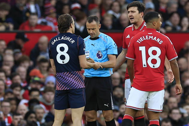 Manchester United, ManU v Tottenham Hotspur, Premier League Conor Gallagher (8) of Tottenham Hotspur gets booked for fouling Harry Maguire (5) of Manchester United during the Premier League match between Manchester United and Tottenham Hotspur at Old Trafford, Manchester, UK on 10 October 2026. Manchester Old Trafford Greater Manchester UK Editorial use only DataCo restrictions apply See www.football-dataco.com , Copyright: xConorxMolloyx PSI-24986-0037