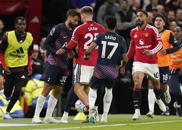 Manchester, England, 10th October 2026. Rodrigo Bentancur of Tottenham Hotspur (L) headsets Luke Shaw of Manchester United, ManU resulting in a red card during the Manchester United vs Tottenham Hotspur Premier League match at Old Trafford, Manchester. Picture credit should read: Andrew Yates Sportimage EDITORIAL USE ONLY. No use with unauthorised audio, video, data, fixture lists, club league logos or live services. Online in-match use limited to 120 images, no video emulation. No use in betting, games or single club league player publications. SPI_044_AY_MANUTD_SPURS SPI-5058-0044