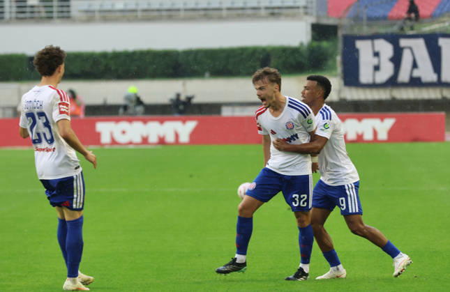 SuperSport HNL, round 09: HNK Hajduk Split v GNK Dinamo Zagreb Simun Hrgovic and Dalisson de Almeida celebrate after Scott McKenna Of GNK Dinamo Zagreb scores a own goal for 1:1 during the SuperSport HNL 2026. 2027. round 09 match between HNK Hajduk Split and GNK Dinamo Zagreb at Poljud Stadium in Split, Croatia on October 10, 2026.  IvoxCagalj PIXSELL