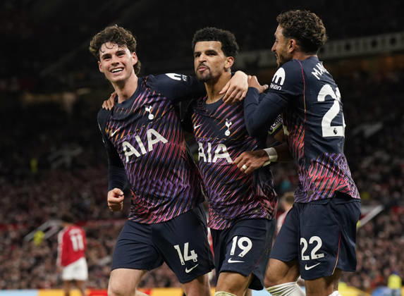 Manchester, England, 10th October 2026. Dominic Solanke of Tottenham Hotspur (C) celebrates after scoring with Archie Gray of Tottenham Hotspur (L) and Omar Marmoush of Tottenham Hotspur during the Manchester United, ManU vs Tottenham Hotspur Premier League match at Old Trafford, Manchester. Picture credit should read: Andrew Yates Sportimage EDITORIAL USE ONLY. No use with unauthorised audio, video, data, fixture lists, club league logos or live services. Online in-match use limited to 120 images, no video emulation. No use in betting, games or single club league player publications. SPI_049_AY_MANUTD_SPURS SPI-5058-0051
