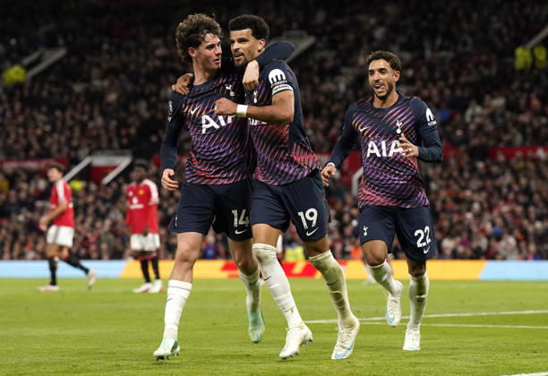 Manchester, England, 10th October 2026. Dominic Solanke of Tottenham Hotspur (C) celebrates after scoring during the Manchester United, ManU vs Tottenham Hotspur Premier League match at Old Trafford, Manchester. Picture credit should read: Andrew Yates Sportimage EDITORIAL USE ONLY. No use with unauthorised audio, video, data, fixture lists, club league logos or live services. Online in-match use limited to 120 images, no video emulation. No use in betting, games or single club league player publications. SPI_050_AY_MANUTD_SPURS SPI-5058-0052
