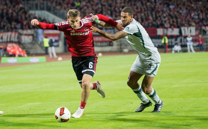 10.10.2026 - Fussball - Saison 2026 2027 - 2. Fussball - Bundesliga - 07. Spieltag: 1. FC Nürnberg FCN ( Club ) - VfL Wolfsburg WOB Wölfe - Sportfoto Zink - xwoxzix - DFL regulations prohibit any use of photographs as image sequences and or quasi-video - only for editorial use - Adam Markhiev (6, 1. FC Nürnberg FCN ) Vini Vinicius de Souza Costa (5, VfL Wolfsburg )