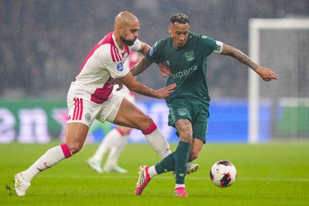 AMSTERDAM , 10-10-2026 , JohanCruyff Arena , season 2026 2027 , Dutch Eredivisie football , Match between Ajax and NEC Nijmegen , picture shows Ajax player Sofyan Amrabat challenges NEC Nijmegen player Tjaronn Chery Ajax - NEC  x208125419x Copyright: