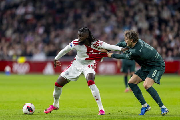 AMSTERDAM - (l-r) AFC Ajax Amsterdam forward Toluwalase Arokodare and N.E.C. Nijmegen defender Perr Schuurs during the Vriendenloterij Eredivisie match between Ajax and N.E.C. at Johan Cruijff ArenA on 10 October 2026 in Amsterdam, Nederland. (Photo by DeFodi Images) -