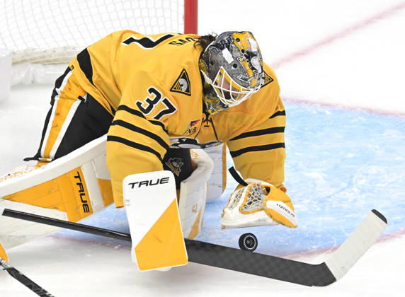 Pittsburgh Penguins goaltender Arturs Silovs (37) dives on the puck during the first period against the Dallas Stars at PPG Paints Arena in Pittsburgh on Saturday, October, 10 2026.  PIT2026101005 ARCHIExCARPENTER