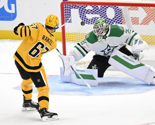 Pittsburgh Penguins right wing Rickard Rakell (67) scores on a penalty shot against Dallas Stars goaltender Jake Oettinger (29) during the overtime shootout of the 2-1 win at PPG Paints Arena in Pittsburgh on Saturday, October, 10 2026.  PIT2026101014 ARCHIExCARPENTER