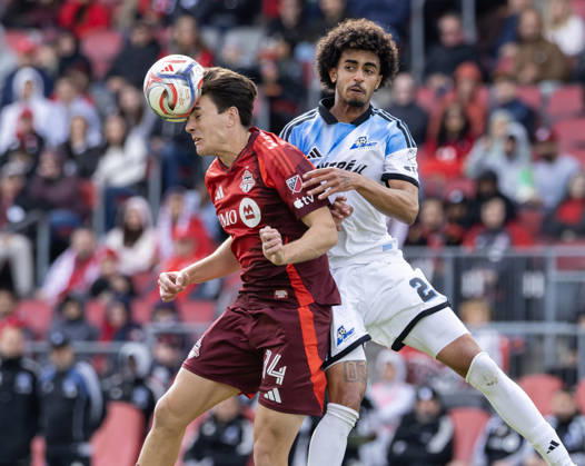 (261011) -- TORONTO, Oct. 11, 2026 -- Alonso Coello (L) of Toronto FC challenges for a header with Jalen Neal of CF Montreal during the 2026 Major League Soccer MLS, Fussball Herren, USA regular season match between Toronto FC and CF Montreal at BMO Field in Toronto, Canada, on Oct. 10, 2026. (Photo by Xinhua) (SP)CANADA-TORONTO-SOCCER-MLS-TORONTO FC VS CF MONTREAL ZouxZheng 