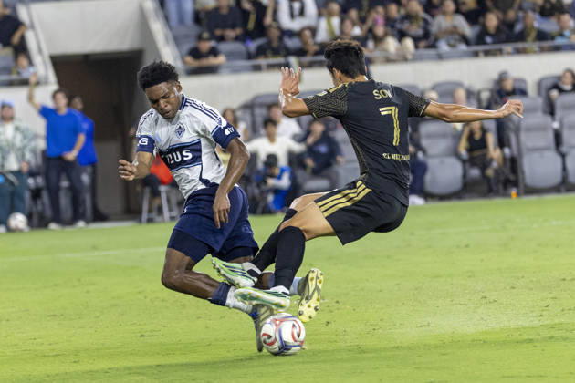 October 10, 2026, Los Angeles, California, USA: Los Angeles FC attacking midfielder Heung Min Son (7) and Vancouver Whitecaps centre back Ralph Priso (6) vie for the ball during a MLS, Fussball Herren, USA soccer game on Saturday, Oct. 10, 2026 in Los Angeles. Los Angeles USA - ZUMAc68_ 20261010_zaf_c68_042 Copyright: xRingoxChiux