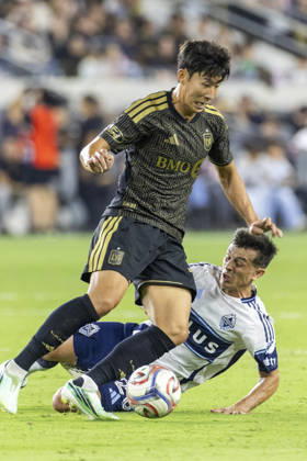 October 10, 2026, Los Angeles, California, USA: Los Angeles FC attacking midfielder Heung Min Son (7) and Vancouver Whitecaps defensive midfielder Andres Cubas (20) vie for the ball during a MLS, Fussball Herren, USA soccer game on Saturday, Oct. 10, 2026 in Los Angeles. Los Angeles USA - ZUMAc68_ 20261010_zaf_c68_053 Copyright: xRingoxChiux