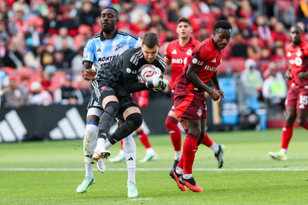 Toronto FC v CF Montreal Luka Gavran 1 of Toronto FC (center) throws himself to collect the ball from Prince Owusu 9 of CF Montreal (left) and Richie Laryea 22 of Toronto FC (right) during a Major League Soccer game between Toronto FC and CF Montreal at BMO Field in Toronto, Ontario, Canada, on October 10, 2026. Toronto Ontario Canada  Copyright: xIndrawanxKumalax originalFilename:kumala-majorlea261010_npTyv.jpg