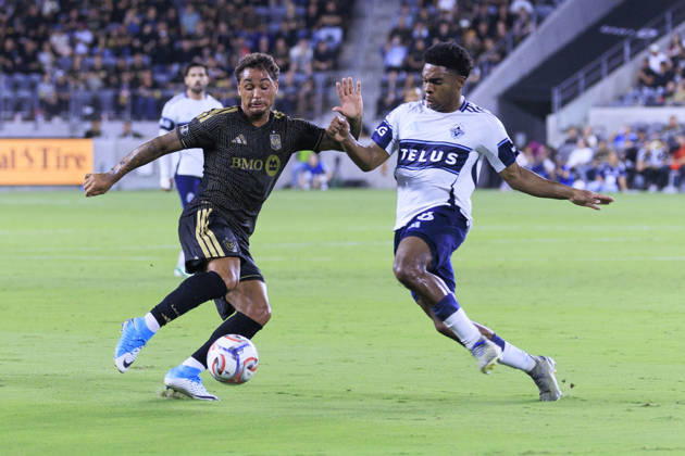 October 10, 2026, Los Angeles, California, USA: Armindo Sieb 9 of the Los Angeles Football Club and Ralph Priso-Mbongue 6 of the Vancouver Whitecaps struggle for possession of the ball during their regular season MLS, Fussball Herren, USA game on Saturday October 10, 2026 at the BMO Stadium in Los Angeles, California. LAFC tie with Whitecaps, 1-1. ARIANA RUIZ PI Los Angeles USA - ZUMAp124 20261010_zaa_p124_014 Copyright: xArianaxRuizx