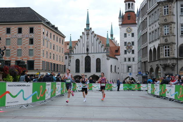 Munich Marathon 2026 MUNICH, GERMANY - OCTOBER 11: Three runners compete through Marienplatz passing the Old Town Hall during the 2026 Munich Marathon in Munich, Germany on October 11, 2026. The annual race takes participants through central landmarks of the Bavarian capital. Merve Goettl Anadolu Munih Germany. Editorial use only. Please get in touch for any other usage.  Copyright: x2026xAnadoluxMervexGoettlx