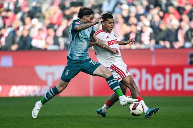 v. li. im Zweikampf Joe Scally (Moenchengladbach 29) Jahmai Simpson-Pusey (Koeln 22) 11.10.2026 ¢ Fussball ¢ 1. FC Koeln vs Borussia Moenchengladbach, RheinEnergieStadion, Koeln, DFB DFL REGULATIONS PROHIBIT ANY USE OF PHOTOGRAPHS AS IMAGE SEQUENCES AND OR QUASI-VIDEO NRW Germany