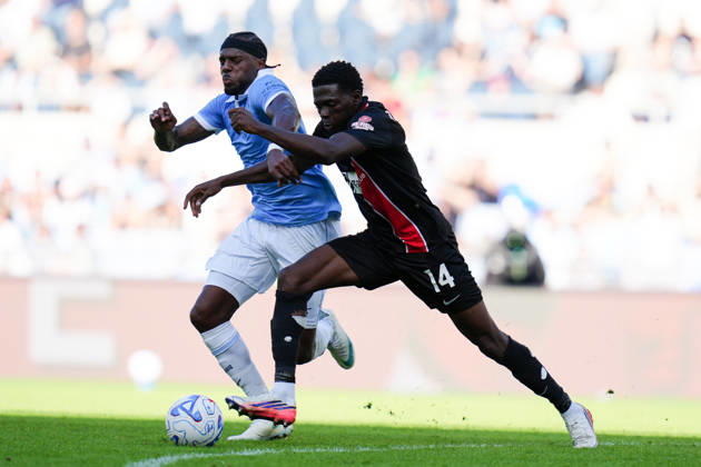 SS Lazio v AC Monza - Serie A Enilive Ebenezer Akinsanmiro of AC Monza and Nuno Tavares of SS Lazio compete for the ball during the Serie A Enilive match between SS Lazio and AC Monza at Olympic Stadium on October 11, 2026 in Rome, Italy. Rome Olympic Stadium Lazio Italy Copyright: xGiuseppexMaffiax 261011_SerieA_Lazio-Monza_GM_07985