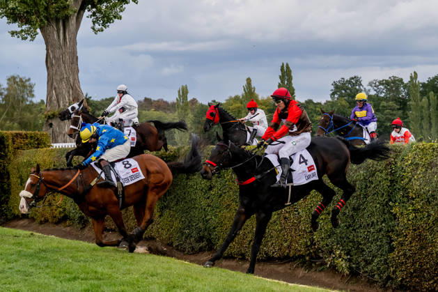 The 136th Grand Pardubice Steeplechase (6,900m), in Pardubice, Czech Republic, on October 11, 2026. The horses cross the Taxis Ditch. In the front, from the right, Adam Cmiel on Caryjape and James Best on Greek Dessert. (CTKxPhoto DavidxTanecek) CTKPhotoP2026101104519  CTKPhotoP2026101104519