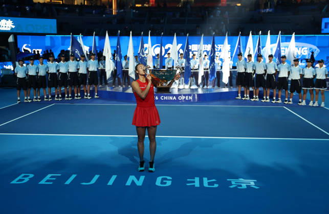 (261011) -- BEIJING, Oct. 11, 2026 -- Zheng Qinwen kisses the trophy during the awarding ceremony after the women s singles final between Zheng Qinwen of China and Mirra Andreeva of Russia at 2026 China Open tennis tournament in Beijing, China, Oct. 11, 2026. ) (SP)CHINA-BEIJING-TENNIS-CHINA OPEN-WOMEN S SINGLES-FINAL (CN) ZhangxChenlin 