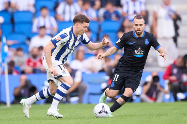 October 11, 2026, San Sebastian, Guipuzcoa, Spain: Sergio Gomez of Real Sociedad competes for the ball with David Mella of RC Deportivo de A Coruna during the LaLiga EA Sports match between Real Sociedad and RC Deportivo de A Coruna at Anoeta on October 11, 2026, in San Sebastian, Spain. Real Sociedad V RC Deportivo De La Coruna - La Liga EA Sports  - ZUMAa181 20261011_zaa_a181_124 Copyright: xRicardoxLarreinax
