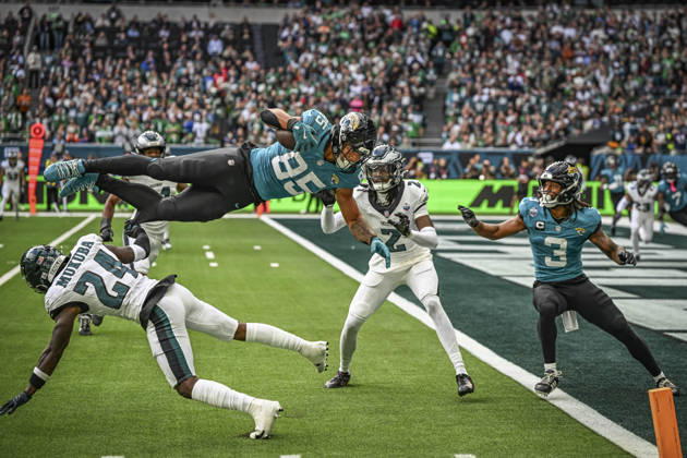 RECORD DATE NOT STATED 11th October 2026; Tottenham Hotspur Stadium, London, England; NFL, American Football Herren, USA International Series American football, Jacksonville Jaguars versus Philadelphia Eagles; Wide receiver Britain Covey of Philadelphia Eagles spins in the air after a tackle by Defensive back Andrew Mukuba of Philadelphia Eagles GodfreyxPitt