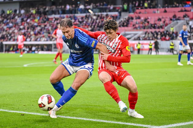 Nikola KatiÄ‡ (FC Schalke 04) und Yuito Suzuki (SC Freiburg) im Zweikampf waehrend des spiels der 1. Bundesliga zwischen Club Freiburg und FC Schalke 04, Europa-Park Stadion am 11. October 2026 in Freiburg im Breisgau, Deutschland. (Foto von Harry Langer DeFodi Images) +++ Nikola KatiÄ‡ (FC Schalke 04) und Yuito Suzuki (SC Freiburg) battle for the ball during the Bundesliga match between Sport-Club Freiburg and FC Schalke 04 at Europa-Park Stadion on October 11, 2026 in Freiburg im Breisgau, Germany. (Photo by Harry Langer DeFodi Images) DFB DFL REGULATIONS PROHIBIT ANY USE OF PHOTOGRAPHS AS IMAGE SEQUENCES AND OR QUASI-VIDEO. (Photo by Harry Langer DeFodi Images) DFB DFL REGULATIONS PROHIBIT ANY USE OF PHOTOGRAPHS AS IMAGE SEQUENCES AND OR QUASI-VIDEO. -