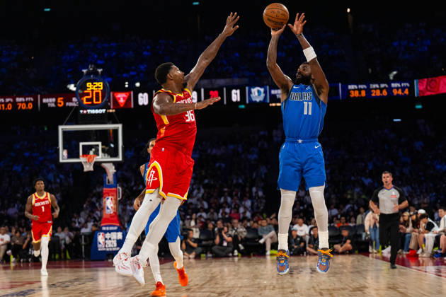 (261011) -- MACAO, Oct. 11, 2026 -- Kyrie Irving (R) of Dallas Mavericks shoots during the 2026-2027 NBA, Basketball Herren, USA preseason game between Dallas Mavericks and Houston Rockets in Macao, south China, on Oct. 11, 2026. ) (SP)CHINA-MACAO-BASKETBALL-NBA PRESEASON-ROCKETS VS MAVERICKS (CN) CheongxKamxKa 