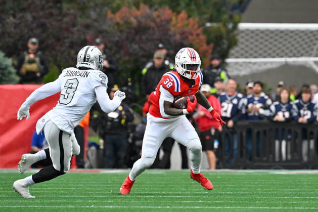 Oct 11, 2026; Foxborough, MA, USA; New England Patriots running back Rhamondre Stevenson (38) runs the ball against Las Vegas Raiders cornerback Taron Johnson (3) during the first half at Gillette Stadium. Mandatory Credit: -Cal Media NFL, American Football Herren, USA 2026: Raiders Vs Patriots OCT 11  - ZUMAc04_ 20261011_zma_c04_136 Copyright: xEricxCanhax