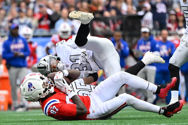 Oct 11, 2026; Foxborough, MA, USA; Las Vegas Raiders safety Treydan Stukes (31) tackles New England Patriots wide receiver Romeo Doubs (87) during the first half at Gillette Stadium. Mandatory Credit: -Cal Media Foxborough USA - ZUMAc04_ 20261011_zma_c04_146 Copyright: xEricxCanhax