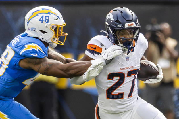 October 11, 2026, Inglewood, California, USA: Denver Broncos Running Back J.K. Dobbins (27) escapes a tackle-attempt by Los Angeles Chargers outside linebacker Bud Dupree (48) during an NFL, American Football Herren, USA football game, in Inglewood, Calif. on Sunday Oct. 11, 2026. Inglewood USA - ZUMAc68_ 20261011_zaf_c68_003 Copyright: xRingoxChiux