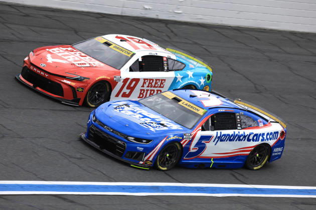 CHARLOTTE, NC - OCTOBER 11: Kyle Larson ( 5 Hendrick Motorsports HendrickCars.com Chevrolet) races with Chase Briscoe ( 19 Joe Gibbs Racing Freebird Spring Water Toyota) into turn 3 during the running of the NASCAR, Motorsport, USA Cup Series Playoffs Bank of America 400 race on October 11, 2026 at Charlotte Motor Speedway in Charlotte, NC. (Photo by Jeff Robinson Icon Sportswire) AUTO: OCT 11 NASCAR Cup Series Playoffs Bank of America 400 EDITORIAL USE ONLY Icon26101112364400