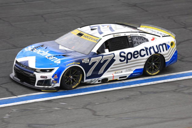 CHARLOTTE, NC - OCTOBER 11: Carson Hocevar ( 77 Spire Motorsports Spectrum Chevrolet) races into turn 3 during the running of the NASCAR, Motorsport, USA Cup Series Playoffs Bank of America 400 race on October 11, 2026 at Charlotte Motor Speedway in Charlotte, NC. (Photo by Jeff Robinson Icon Sportswire) AUTO: OCT 11 NASCAR Cup Series Playoffs Bank of America 400 EDITORIAL USE ONLY Icon26101112930400