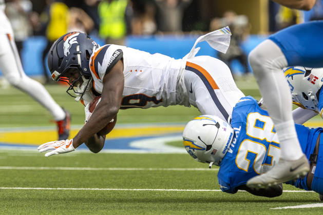 October 11, 2026, Inglewood, California, USA: Denver Broncos Wide Receiver Marvin Mims Jr. (19) is brought down by Los Angeles Chargers running back Kimani Vidal (28) during an NFL, American Football Herren, USA football game, in Inglewood, Calif. on Sunday Oct. 11, 2026. Inglewood USA - ZUMAc68_ 20261011_zaf_c68_025 Copyright: xRingoxChiux