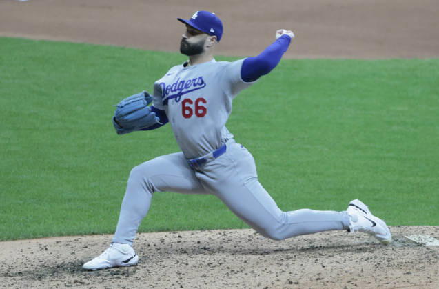 Los Angeles Dodgers pitcher Tanner Scott (66) throws against the Milwaukee Brewers in the eighth inning of an MLB, Baseball Herren, USA National League Championship Series playoff game at American Family Field in Milwaukee, Wisconsin, on Sunday, October 11, 2026.  MIL20261011726 TANNENxMAURY