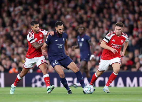 London, England, 13th October 2026. Bruno Guimaraes of Arsenal tackles Nabil Bentaleb of LOSC Lille during the Arsenal vs LOSC Lille UEFA Champions League match at the Emirates Stadium, London. Picture credit should read: David Klein Sportimage EDITORIAL USE ONLY. No use with unauthorised audio, video, data, fixture lists, club league logos or live services. Online in-match use limited to 120 images, no video emulation. No use in betting, games or single club league player publications. SPI_024_DK_Arsenal_Lille SPI-5065-0025