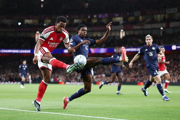London, England, 13th October 2026. Jurrien Timber of Arsenal tussles with Nathan Ngoy of LOSC Lille during the Arsenal vs LOSC Lille UEFA Champions League match at the Emirates Stadium, London. Picture credit should read: David Klein Sportimage EDITORIAL USE ONLY. No use with unauthorised audio, video, data, fixture lists, club league logos or live services. Online in-match use limited to 120 images, no video emulation. No use in betting, games or single club league player publications. SPI_027_DK_Arsenal_Lille SPI-5065-0028