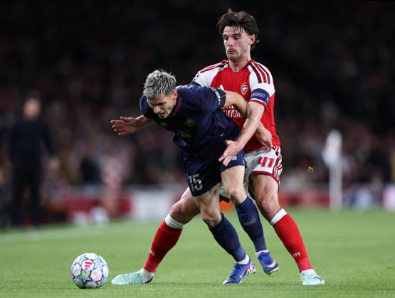 London, England, 13th October 2026. Romain Perraud of LOSC Lille tackled by Declan Rice of Arsenal during the Arsenal vs LOSC Lille UEFA Champions League match at the Emirates Stadium, London. Picture credit should read: David Klein Sportimage EDITORIAL USE ONLY. No use with unauthorised audio, video, data, fixture lists, club league logos or live services. Online in-match use limited to 120 images, no video emulation. No use in betting, games or single club league player publications. SPI_030_DK_Arsenal_Lille SPI-5065-0031