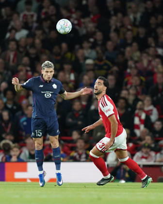 Arsenal v Lille OSC, UEFA Champions League Romain Perraud of Lille under pressure from Mikel Merino of Arsenal during Arsenal v Lille OSC UEFA Champions League matchday 2 at the Emirates Stadium, London, England on 13 October 2026 Credit: Dylan Hepworth Every Second Media Editorial use only. All images are copyright Every Second Media Limited. No images may be reproduced without prior permission. Copyright: xIMAGO EveryxSecondxMediax ESM-2215-0037 DylanxHepworthx xEveryxSecondxMediax