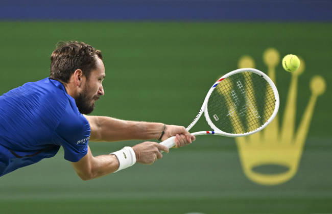(261014) -- SHANGHAI, Oct. 14, 2026 -- Daniil Medvedev of Russia hits a return during the men s round of 16 match against Stefanos Tsitsipas of Greece at the 2026 ATP, Tennis Herren tour Shanghai Masters tennis tournament in Shanghai, China, Oct. 14, 2026. ) (SP)CHINA-SHANGHAI-TENNIS-SHANGHAI MASTERS-MEN S SINGLES (CN) ChenxHaoming 