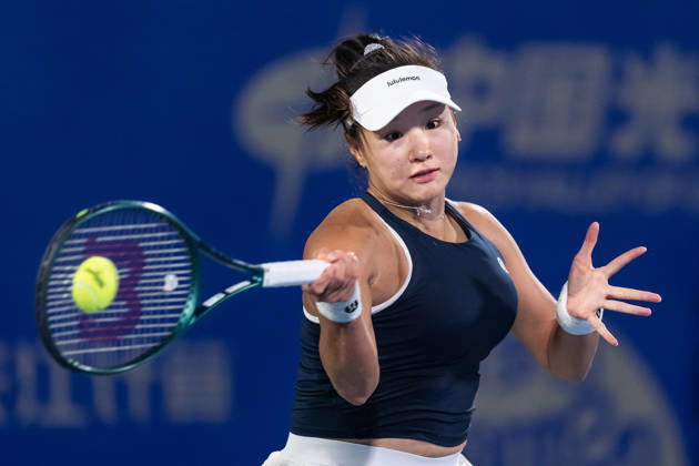 October 14, 2026, Wuhan, Hubei, China: Hanyu Guo of China plays against Katie Volynets of USA ( not in view) during the Wuhan Open final match at the Optics Valley International Tennis Center. Hanyu Guo defeated Katie Volynets with a score of 6-4, 4-6, 7-6. Wuhan China - ZUMAs197 20261014_aaa_s197_095 Copyright: xRenxYongx