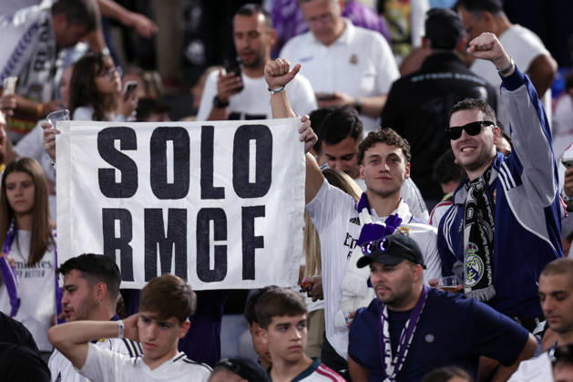 SOCCER - UEFA Champions League - AS Roma vs. Real Madrid Photo by IPA ABACAPRESS.COM89686138 - Rome, Italy — October 14, 2026: A Real Madrid fan in the stands holding a Mourinho banner and Lazio flags during the 2026–2027 UEFA Champions League soccer match between AS Roma and Real Madrid CF at the Olympic Stadium in Rome. Rome Italy Copyright: xIPAxSport ABACAx