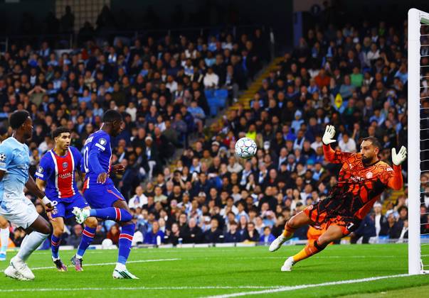 Ousmane Dembele of Paris Saint Germain scores a goal to make it 0-2 past Manchester City goalkeeper Gianluigi Donnarumma Manchester City v Paris Saint-Germain, UEFA Champions League, Football, Etihad Stadium, Manchester, UK - 14 Oct 2026Manchester Etihad Stadium United Kingdom  Copyright: xMattxWest Shutterstockx 17216000v