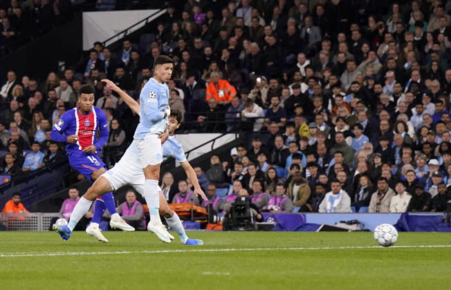 Manchester, England, 14th October 2026. Desire Doue of Paris Saint-Germain scores the first goal during the Manchester City vs Paris Saint Germain UEFA Champions League match at the Etihad Stadium, Manchester. Picture credit should read: Andrew Yates Sportimage EDITORIAL USE ONLY. No use with unauthorised audio, video, data, fixture lists, club league logos or live services. Online in-match use limited to 120 images, no video emulation. No use in betting, games or single club league player publications. SPI_018_AY_Man_City_PSG SPI-5069-0018