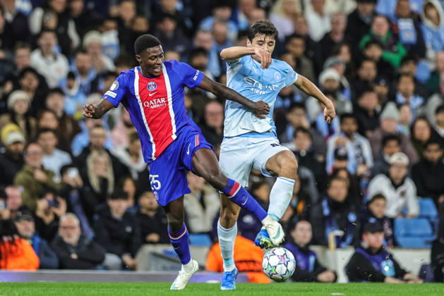 UEFA Champions League Matchday 2 of 8 Manchester City v Paris Saint-Germain Nuno Mendes of Paris Saint-Germain and Abdukodir Khusanov of Manchester City battle for the ball during the UEFA Champions League Matchday 2 of 8 match Manchester City vs Paris Saint-Germain at City of Manchester Stadium, Manchester, United Kingdom on 14 October 2026 (Photo by Mark Cosgrove News Images) Manchester City of Manchester Stadium Greater Manchester United, ManU Kingdom Copyright: xMarkxCosgrove NewsxImagesx