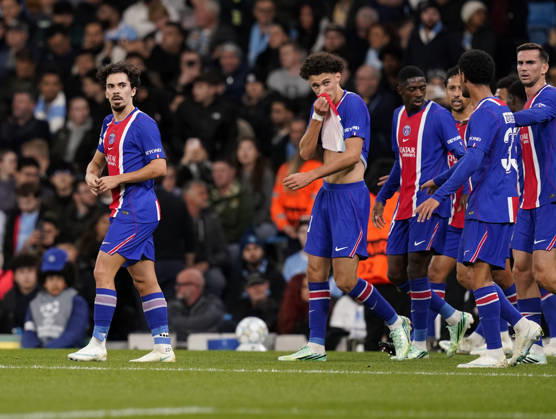 Manchester, England, 14th October 2026. Vitinha of Paris Saint-Germain (l) leads the players back after he scored their third goal during the Manchester City vs Paris Saint Germain UEFA Champions League match at the Etihad Stadium, Manchester. Picture credit should read: Andrew Yates Sportimage EDITORIAL USE ONLY. No use with unauthorised audio, video, data, fixture lists, club league logos or live services. Online in-match use limited to 120 images, no video emulation. No use in betting, games or single club league player publications. SPI_034_AY_Man_City_PSG SPI-5069-0029